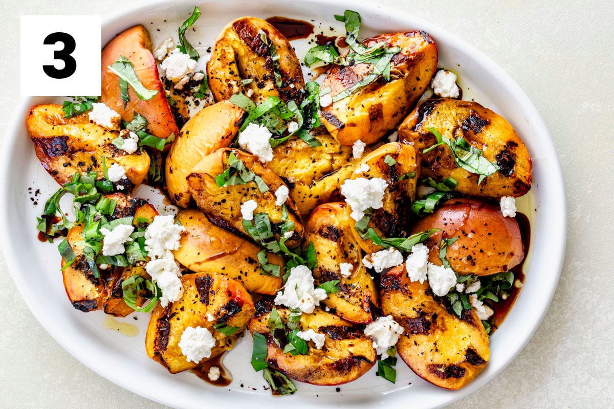 add the toppings to the grilled peaches