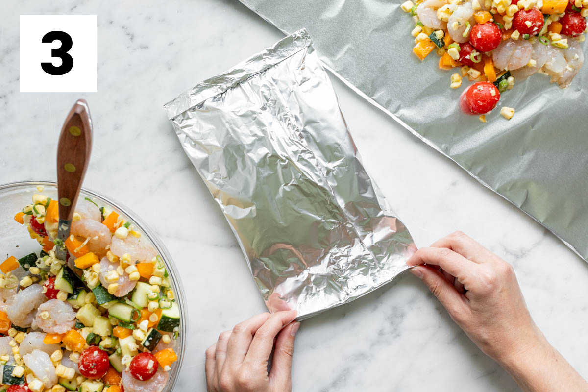 make the foil packets full of veggies and shrimp