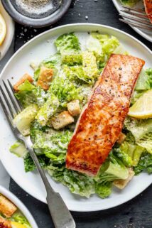 the salmon caesar on a white plate