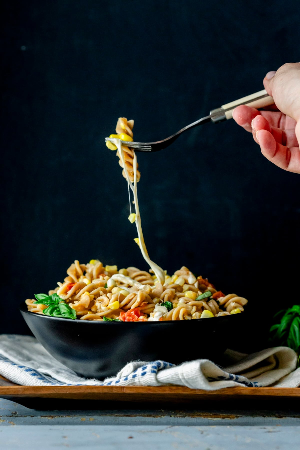 the pasta with mozzarella with a big cheese pull
