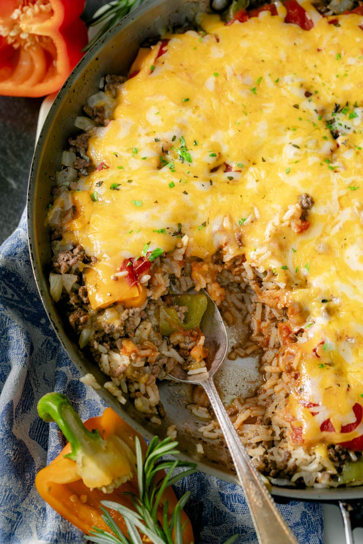 the skillet with the rice mixture and cheese on top with a big scoopful removed from the side of the pan