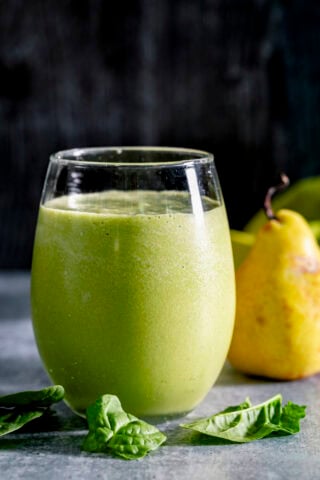 the green smoothie on a gray table