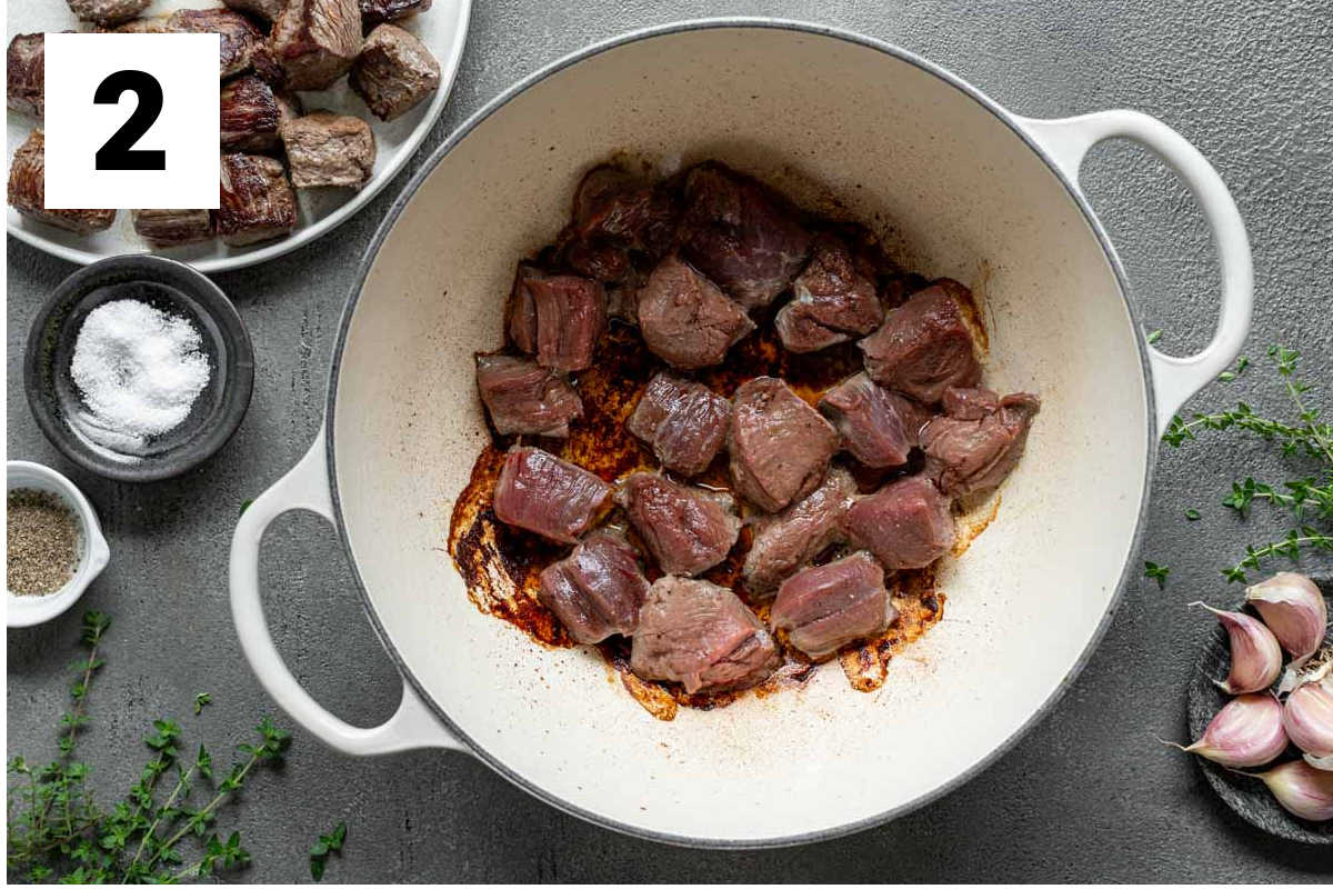 searing the venison in the Dutch Oven