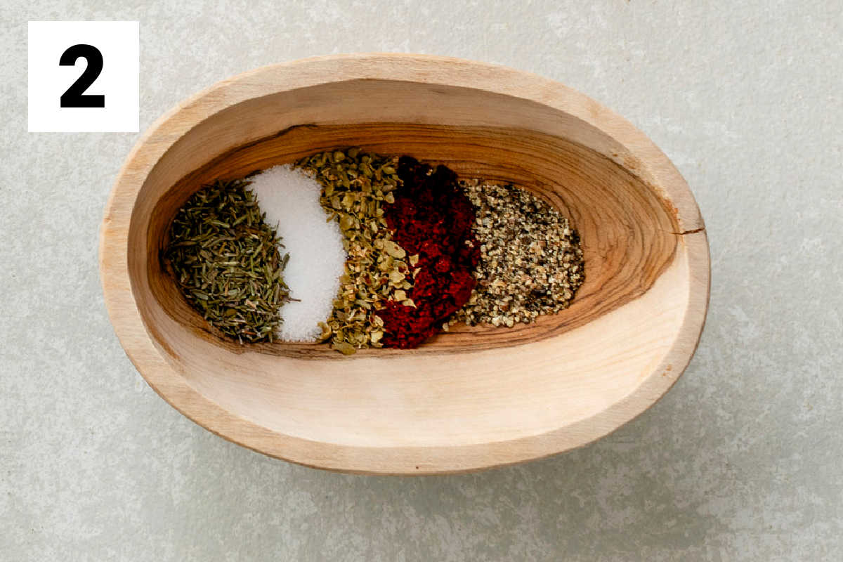 The spices for the potatoes in a small wooden dish