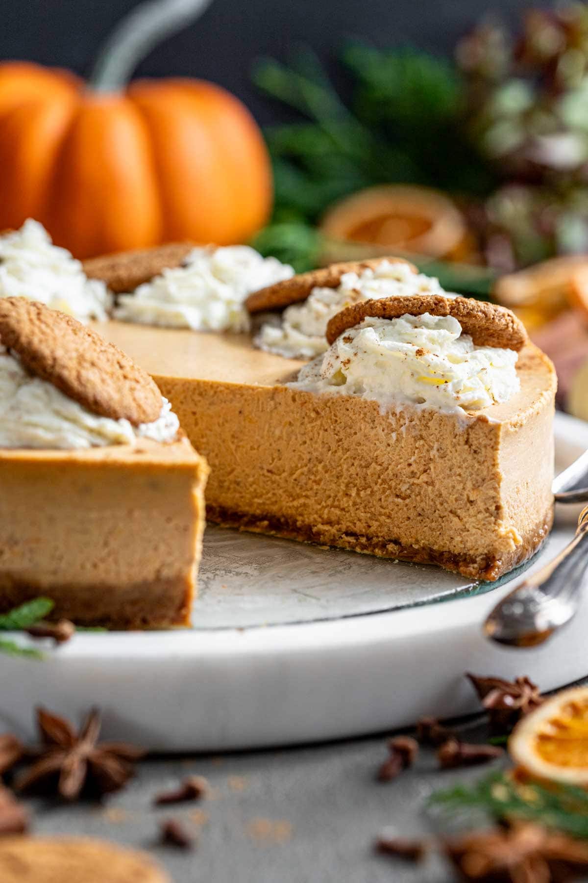 a close-up of the cheesecake with a slice removed
