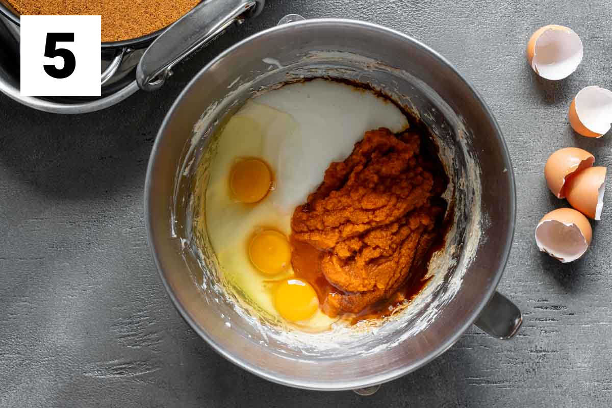 the liquid ingredients in the bowl before they are beaten into the cream cheese mixture
