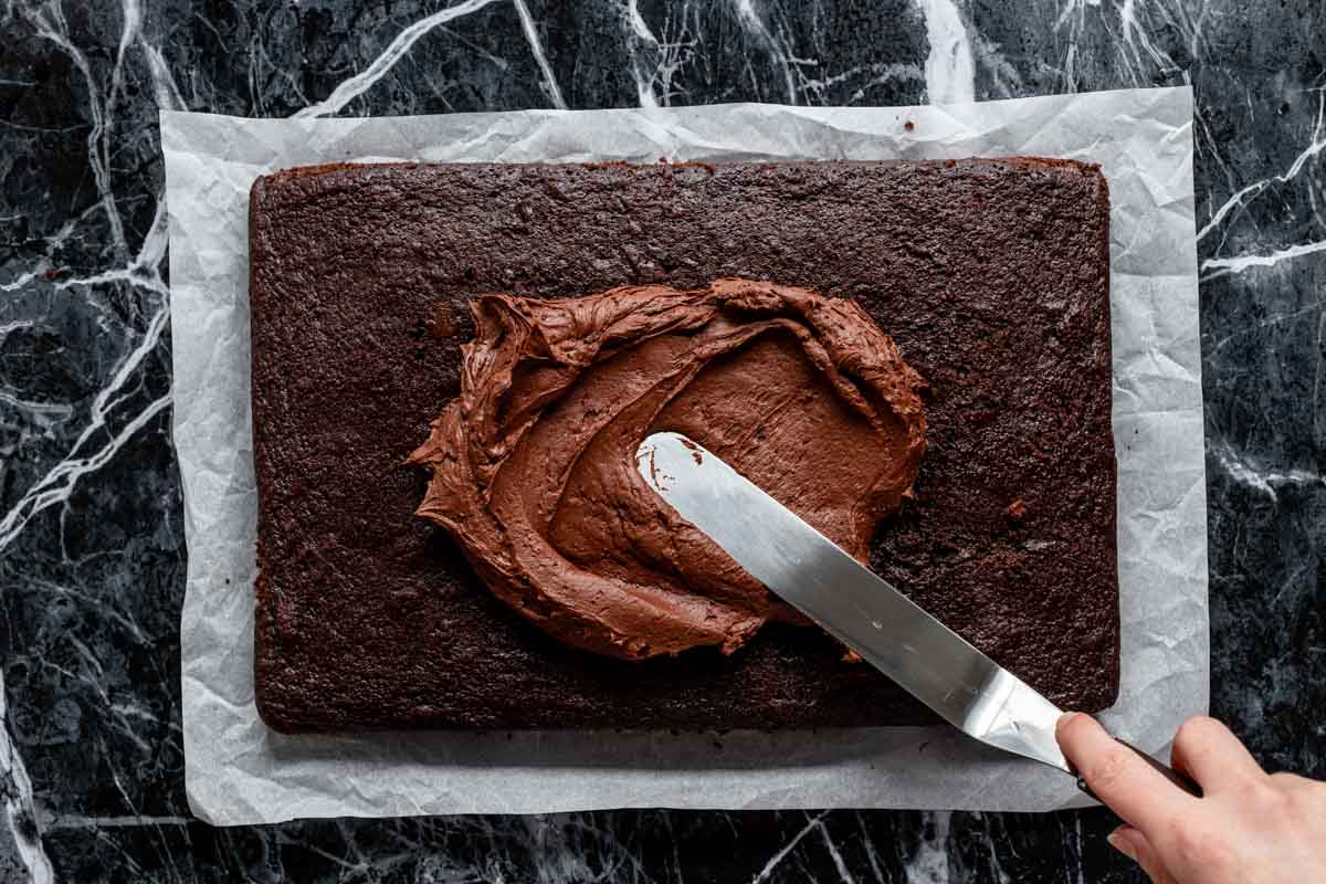 Spreading the frosting over the cake