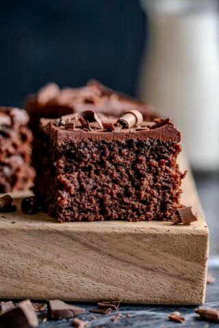the slice of cake on a board from the side