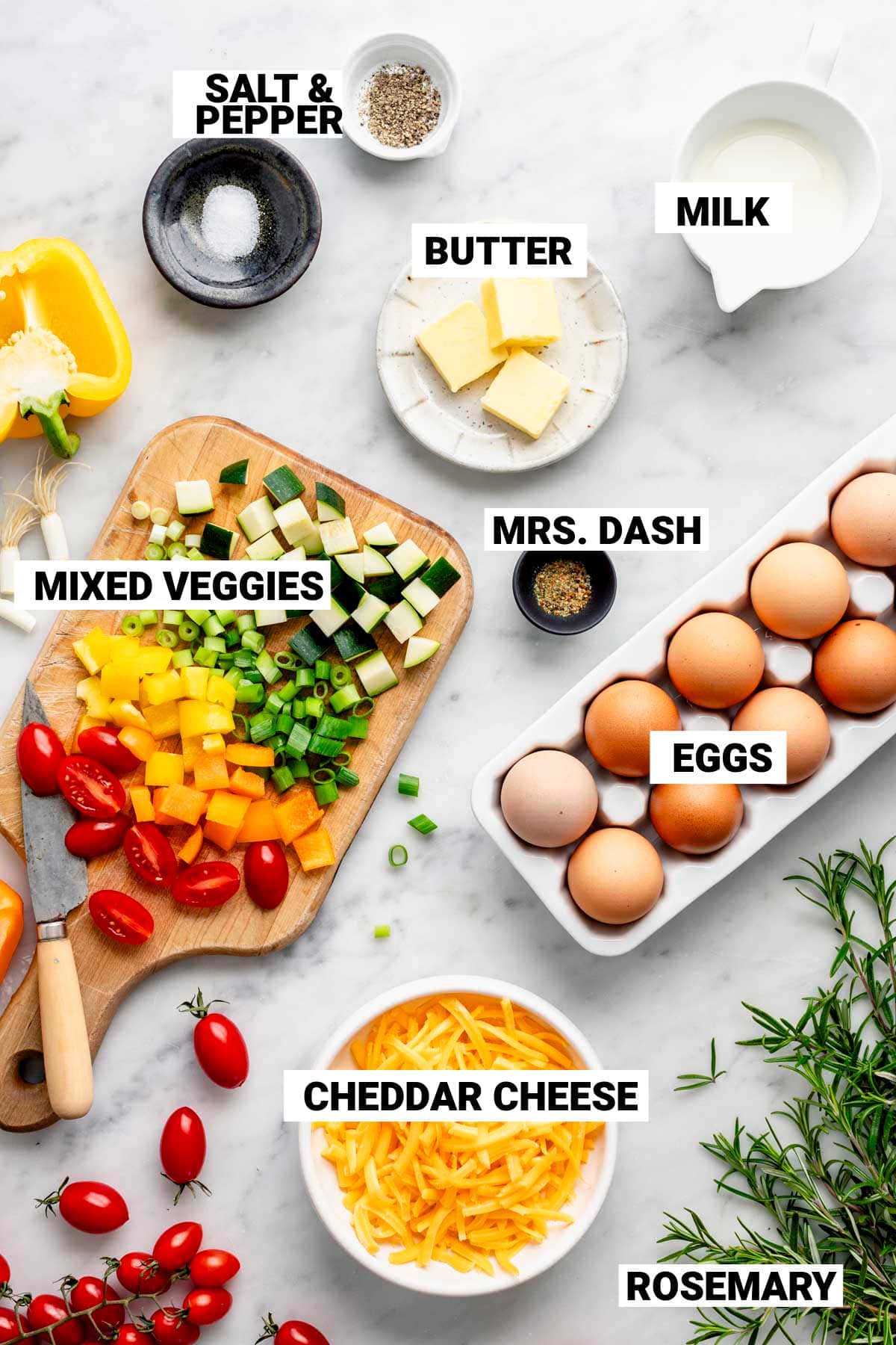 the ingredients for the veggie frittata on a marble countertop